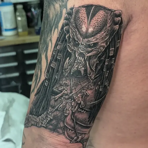 Realism predator portrait tattoo by @maisie.llewellyn