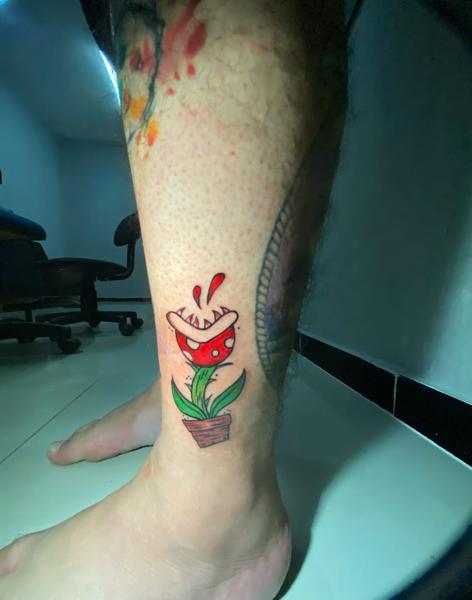 Cartoon piranha plant tattoo by @mama.tattooo