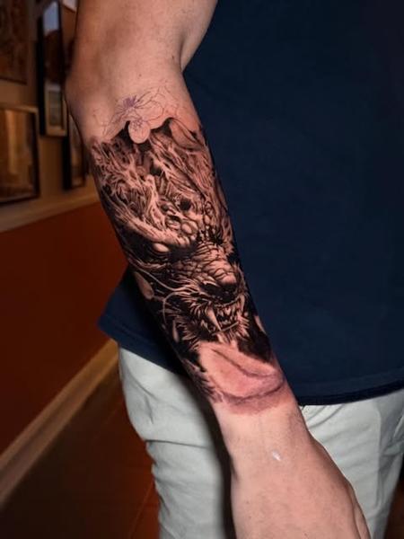 Realism dragon tattoo by @manic.tatts