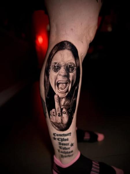 Realism rockstar portrait tattoo by @manic.tatts