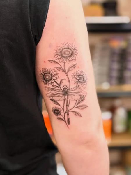 Fine line dragonfly with flowers tattoo by @manic.tatts