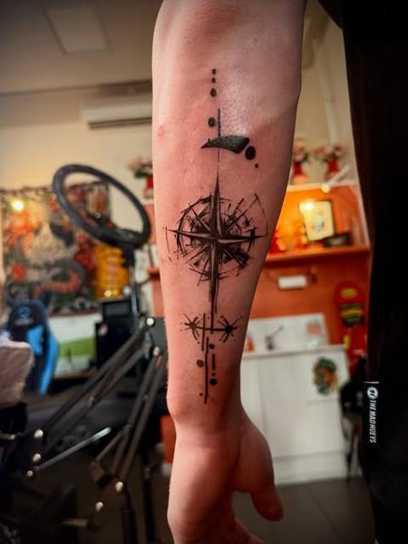 Geometric compass design tattoo by @manic.tatts