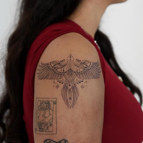 Fine line ornamental ornamental bird tattoo by @manvmadetattoos