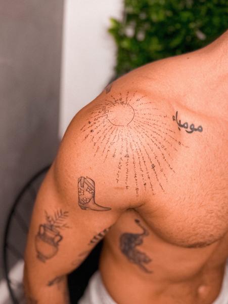 Fine line text sunburst tattoo by @katerinedovasink