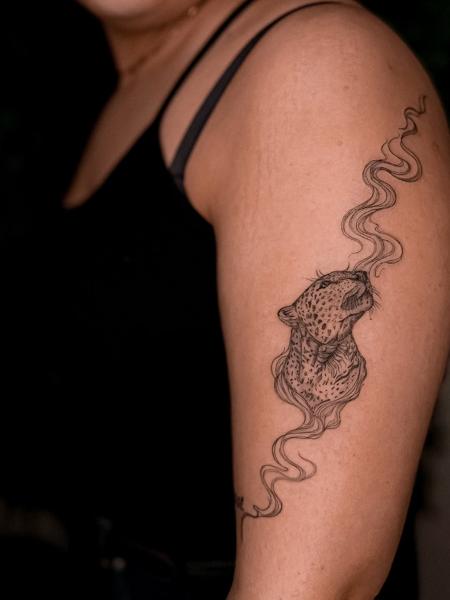 Fine line leopard head tattoo by @katerinedovasink