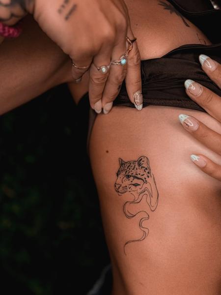 Fine line leopard head tattoo by @katerinedovasink