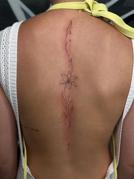 Fine line floral line tattoo by @marcelclaude.tattoo