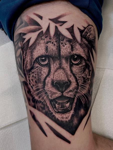 Realism cheetah portrait tattoo by @marc_studio_ink