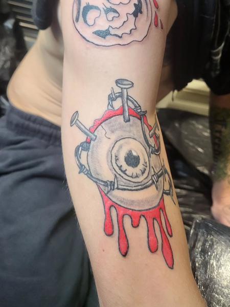 Illustrative nailed eyeball tattoo by @blood_sweat_and_tears_tattoo