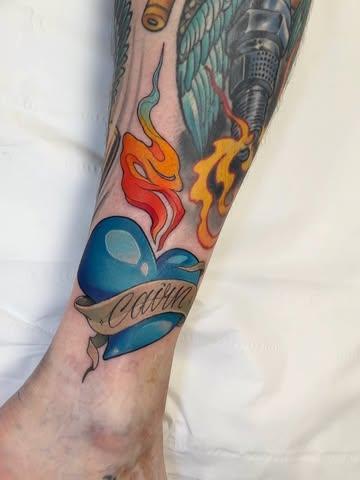 Traditional blue heart tattoo by @marcustattoos