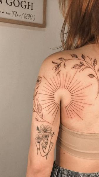 Fine line sun and floral tattoo by @marditattoo