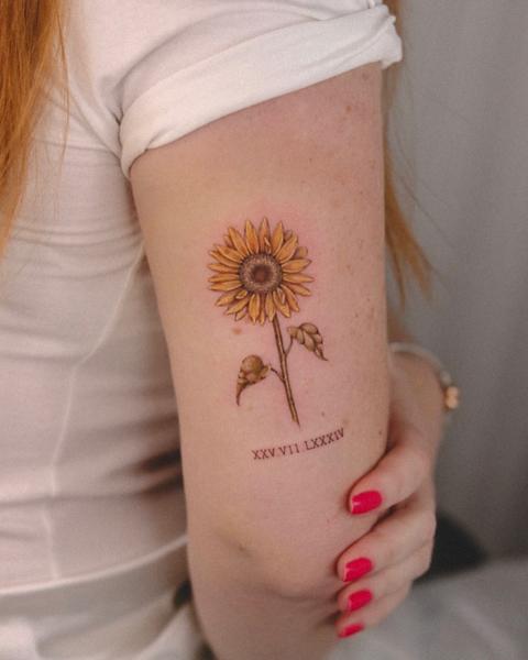 Illustrative sunflower with text tattoo by @marditattoo