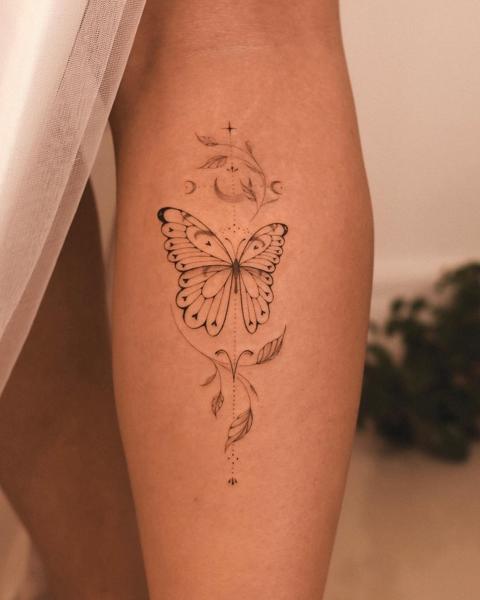 Fine line ornamental butterfly tattoo by @marditattoo