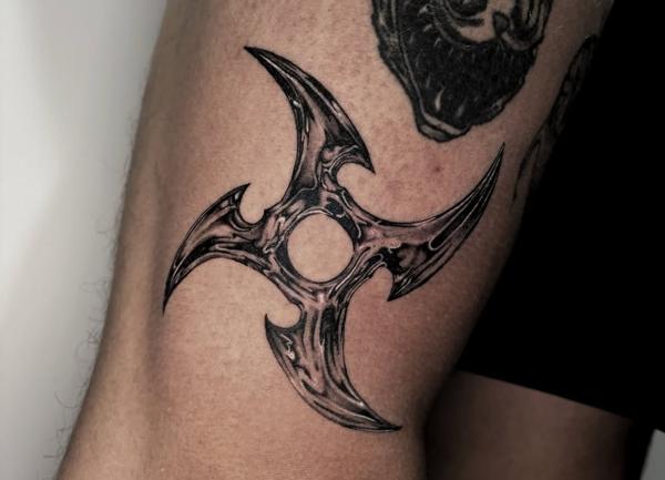 Realism shuriken tattoo by @mazira.tattoos
