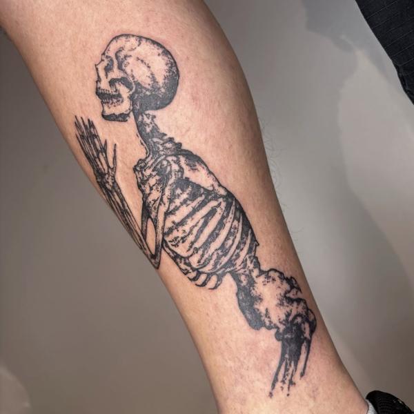 Blackwork praying skeleton tattoo by @mazira.tattoos