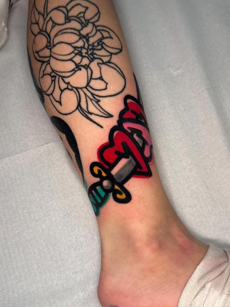 Traditional dagger heart tattoo by @darksumi_tattoo