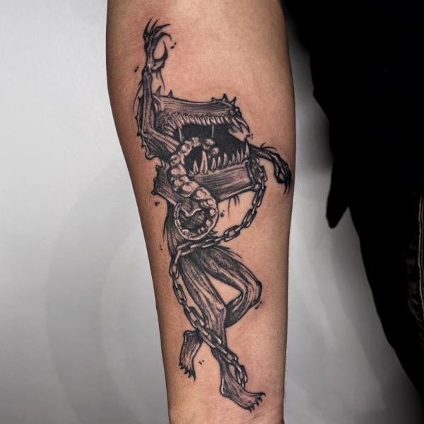 Illustrative monster book tattoo by @mazira.tattoos
