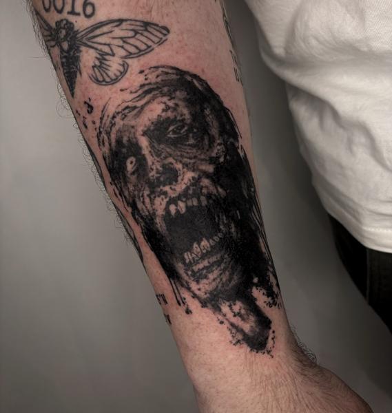 Blackwork zombie face tattoo by @mazira.tattoos