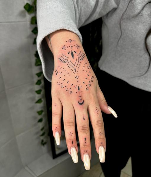 Ornamental ornamental hand tattoo by @garagetattooshop