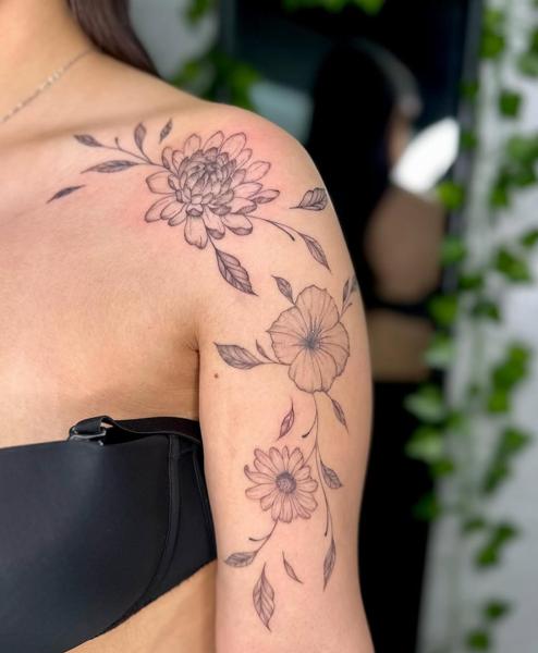 Fine line floral arrangement tattoo by @garagetattooshop