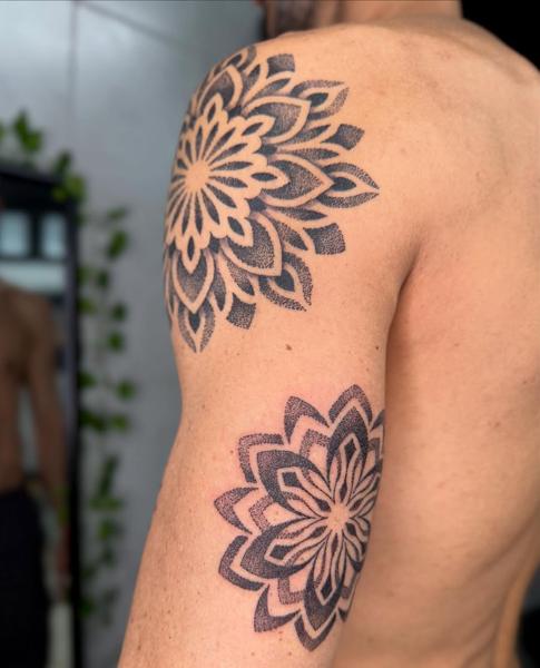 Dotwork mandala flowers tattoo by @garagetattooshop