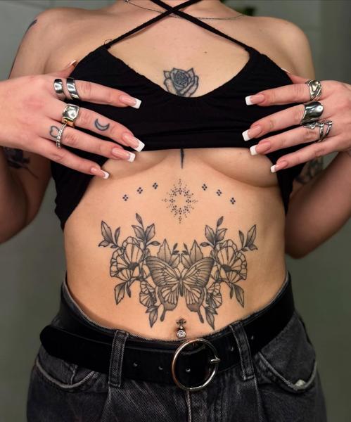 Fine line butterfly and flowers tattoo by @garagetattooshop