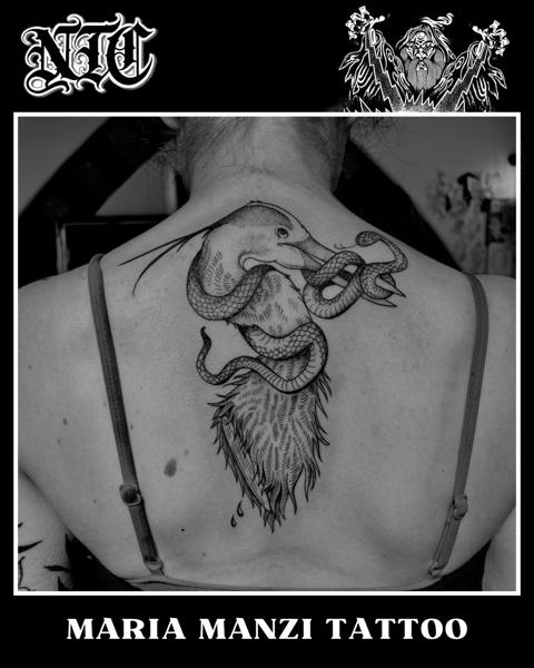 Blackwork snake and bird tattoo by @mariamanzitattoo