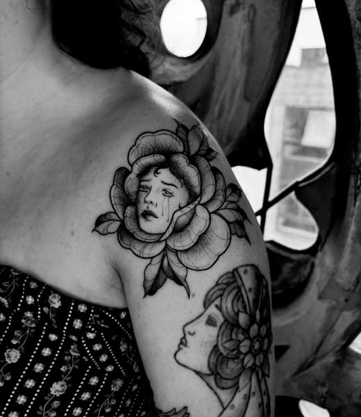 Blackwork crying flower face tattoo by @mariamanzitattoo