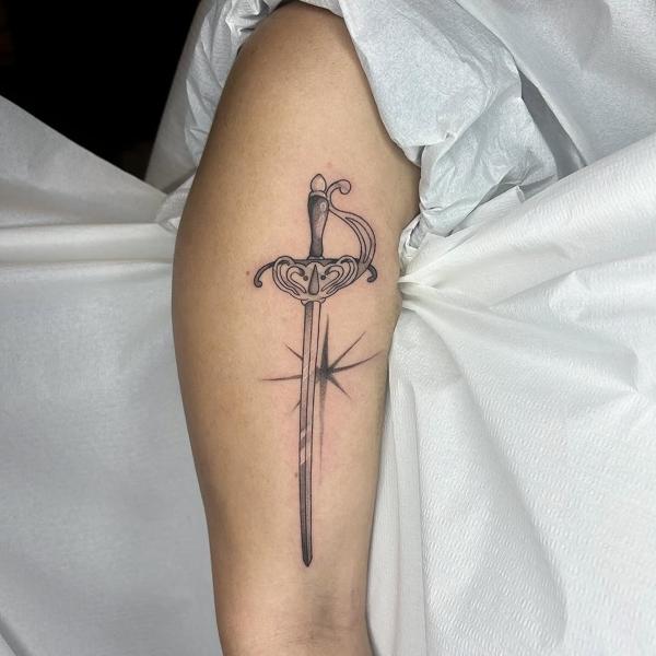Fine line ornate sword tattoo by @myboo_tattoo
