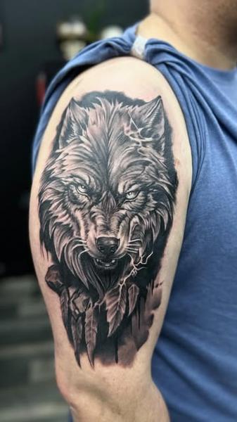 Realism aggressive wolf tattoo by @mariusz_detka_tattoo