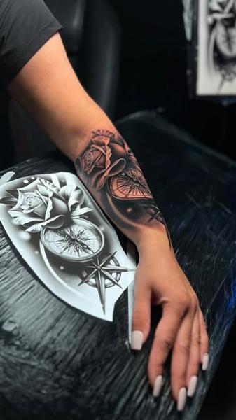 Realism rose compass tattoo by @mariusz_detka_tattoo
