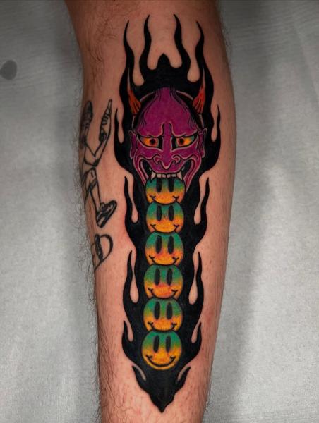 Neo-traditional demon with smiley faces tattoo by @quipstertattoos