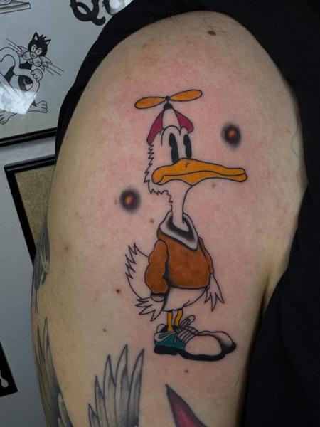 Traditional cartoon duck tattoo by @quipstertattoos