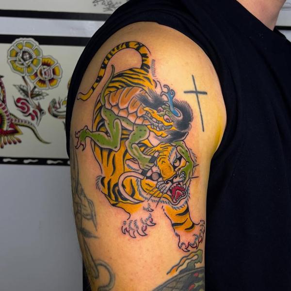 Traditional tiger and demon tattoo by @quipstertattoos