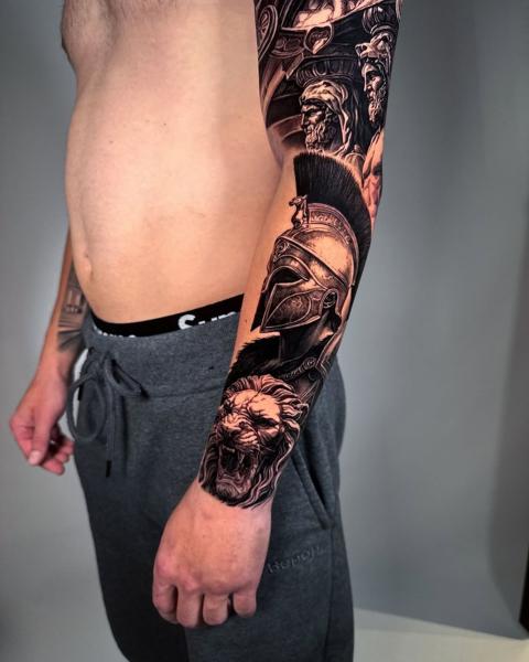 Realism spartan lion tattoo by @markwosgerau