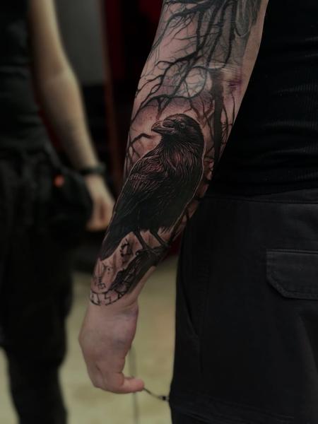 Black and grey realism raven forest moon tattoo by @markwosgerau