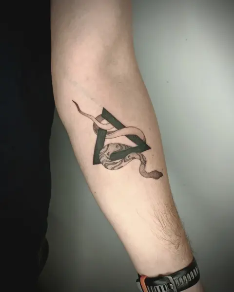 Blackwork geometric snake tattoo by @martatattoos