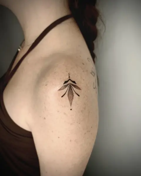 Fine line blackwork stylized leaf tattoo by @martatattoos