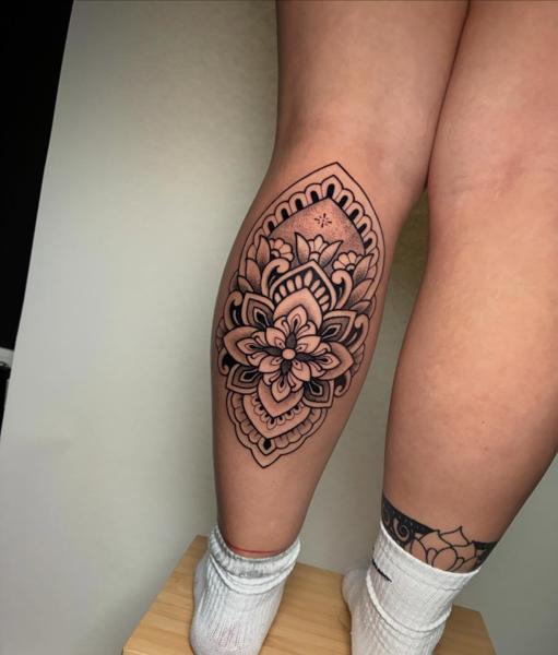 Ornamental mandala flower tattoo by @mate.arnoth.tattoos