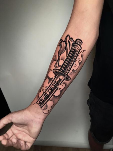 Traditional katana tattoo by @mate.arnoth.tattoos