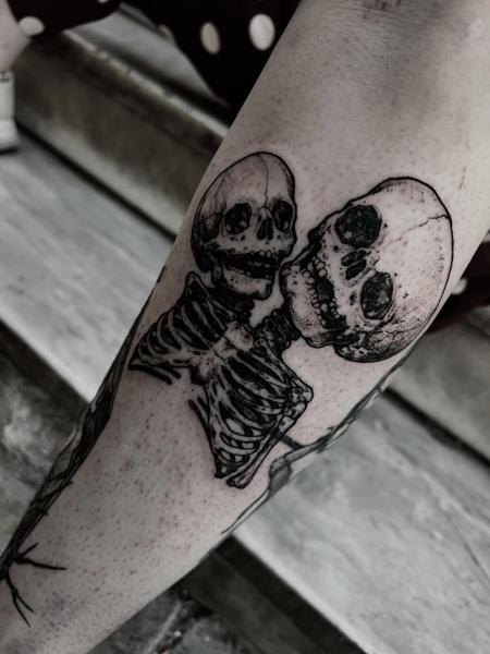 Blackwork conjoined skeletons tattoo by @matina_macabre_tatt