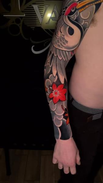 Japanese crane and flower tattoo by @mattedwardstattoos