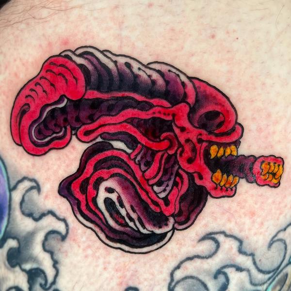Illustrative alien creature tattoo by @matt.ono.tattoo