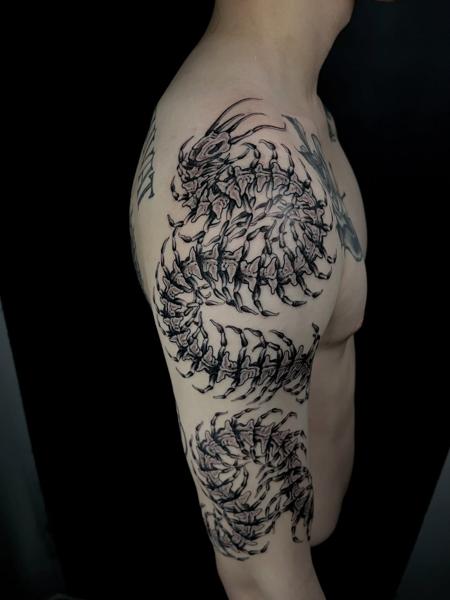 Blackwork skeletal dragon tattoo by @matt.ono.tattoo