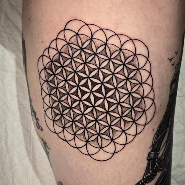 Geometric flower of life tattoo by @matty_nate_tattoos