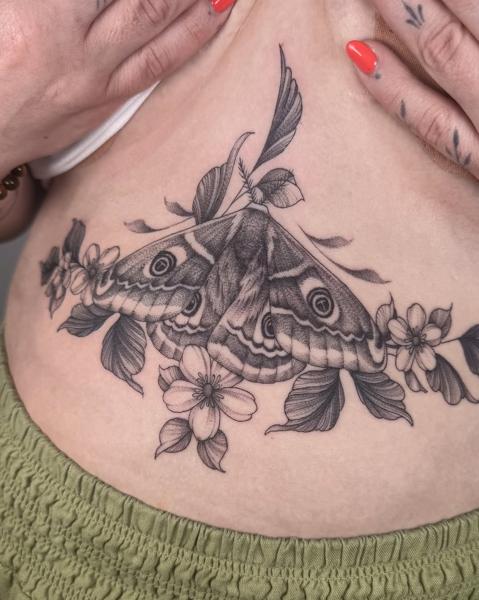 Illustrative blackwork floral moth tattoo by @meganbirdtattoo