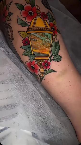 Neo-traditional lantern flowers sunset tattoo by @meg.tattz