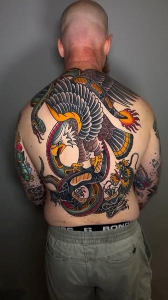 Traditional eagle snake dragon tattoo by @meg.tattz