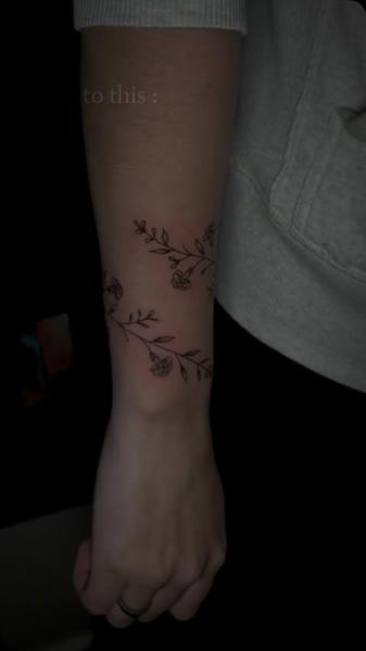Fine line floral branches tattoo by @megz.ink