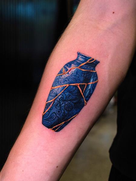 Realism kintsugi vase tattoo by @melange.tattoo